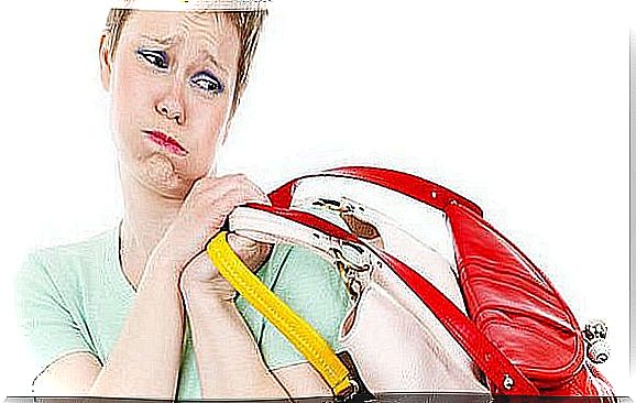 Woman carrying colorful handbags