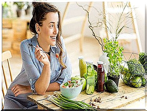 Woman eating salad.