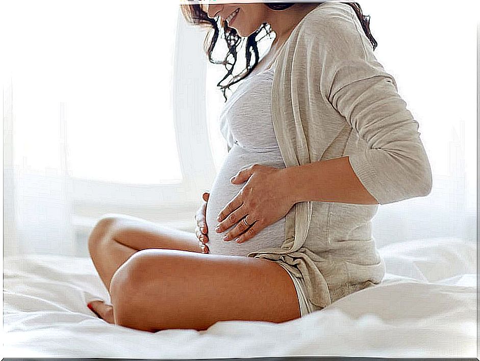 pregnant woman on the bed