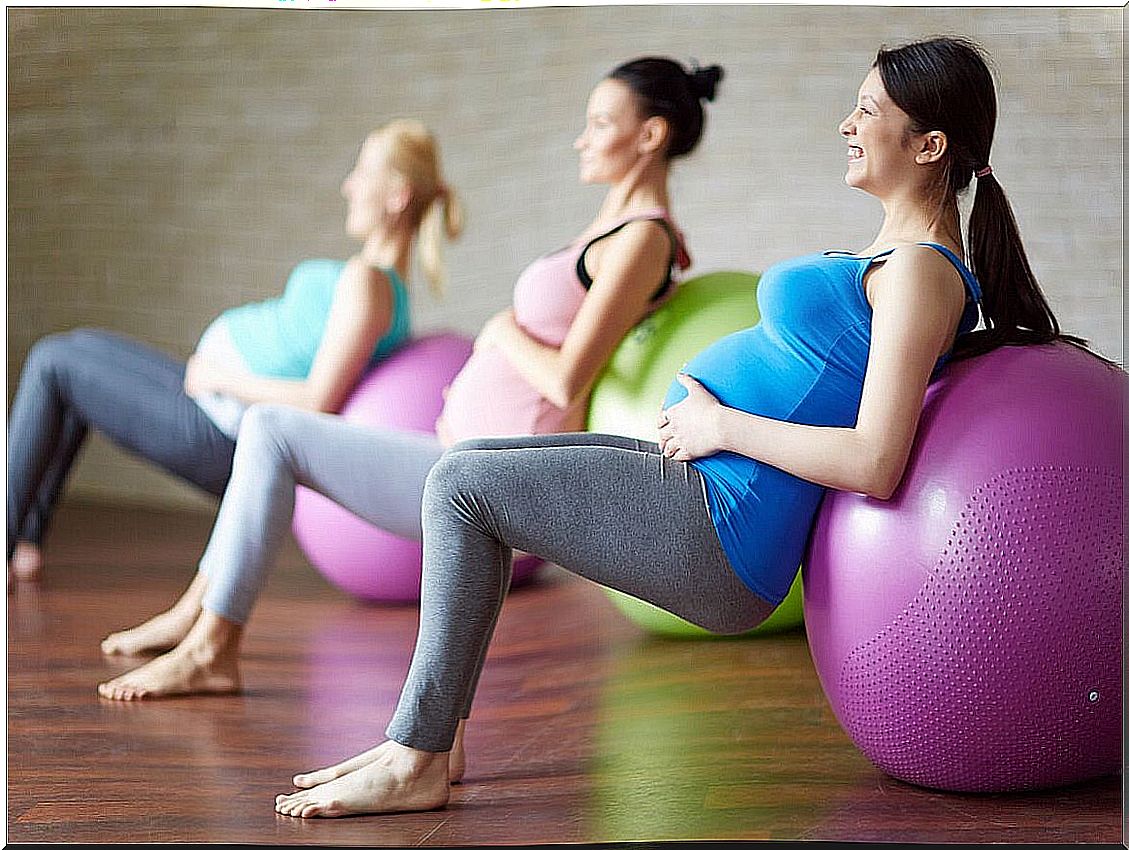 Pregnant women doing sports with ball.