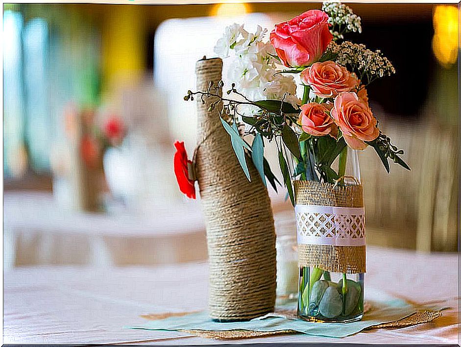 Flowerpots made with decorated bottles.