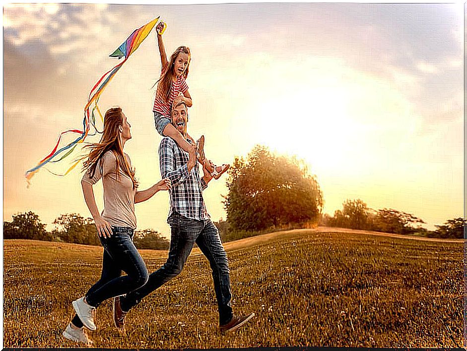 Family playing in the field.